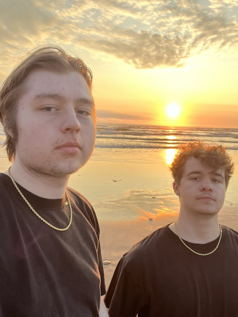 elijah (left) and lucas (right) at the coast
